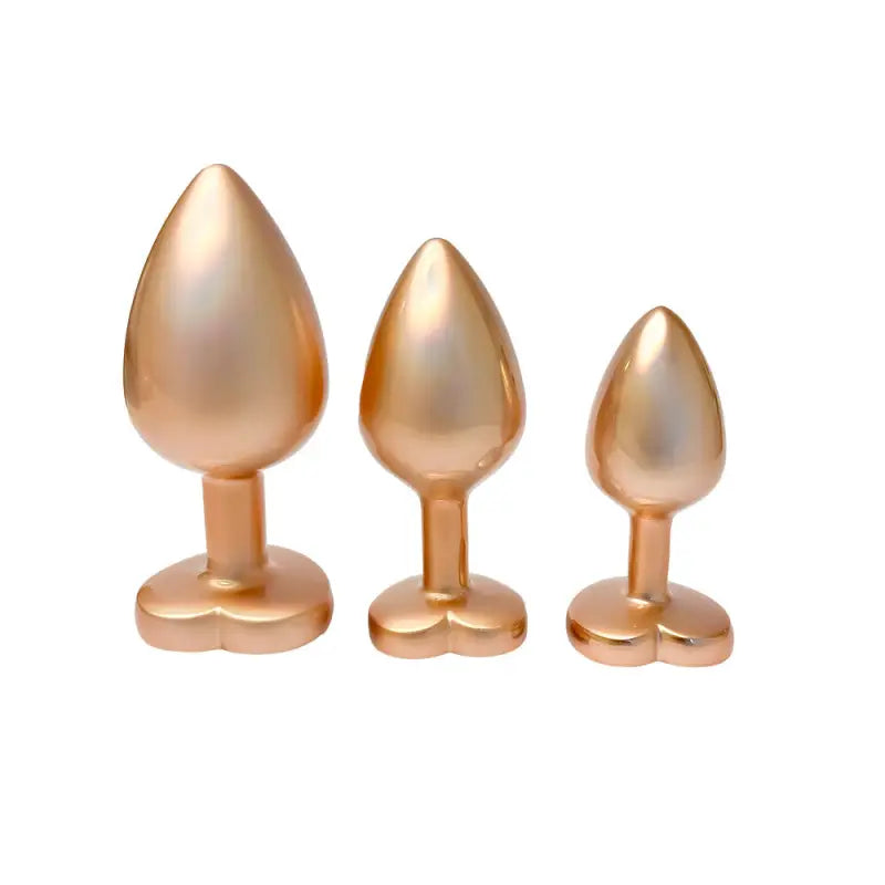 Experience Elegance with Gleaming Love Pearl Gold Butt Plugs